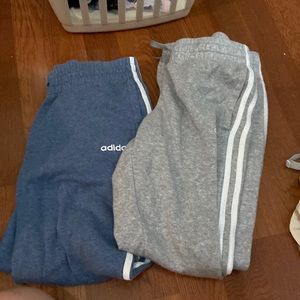 two pairs of adidas sweatpants